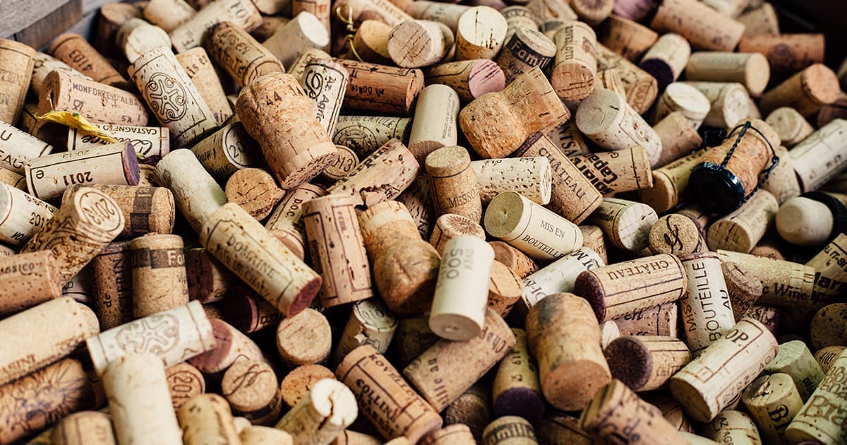 A pile of different wine corks from various types of wine.